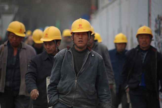People wearing yellow safety helmets