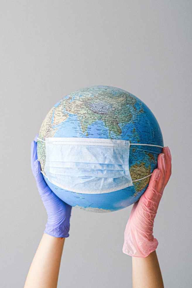 Picture of a globe with a face mask